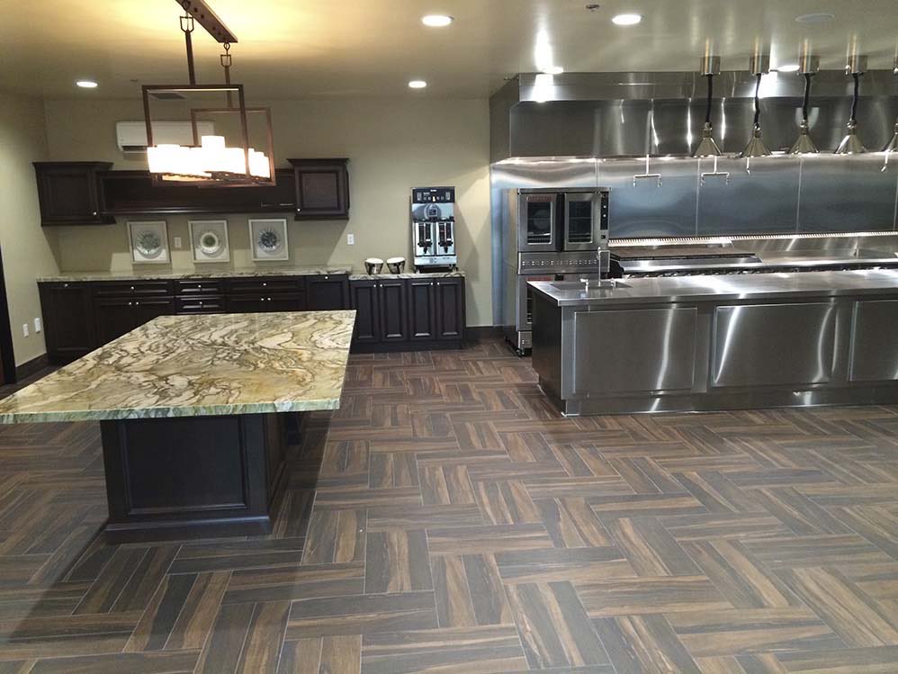 Private Commercial Kitchen: Stone-topped serving island